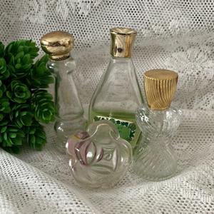 4 Vintage Perfume Bottles. 1 has perfume. Nice for display. 1 Yardley/3 Avon